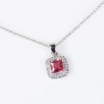 Niche square halo zircon jewelry set wholesale featuring a cushion-cut center gem enclosed by a pave cubic zirconia halo with matching stud earrings from junejewelry.com