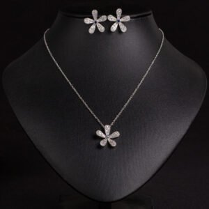 Niche five petal flower jewelry set wholesale featuring a delicate micro-pave CZ five petal blossom pendant necklace and matching flower stud earrings from junejewelry.com