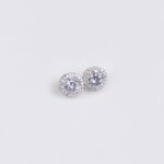Niche round halo zircon jewelry set wholesale featuring a brilliant round-cut central crystal surrounded by a pave cubic zirconia halo with matching stud earrings from junejewelry.com