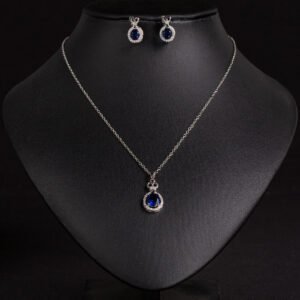 Niche crown zircon halo pendant necklace earring set wholesale featuring a micro-pave crown bail suspending a halo-set round crystal pendant with matching stud earrings from junejewelry.com
