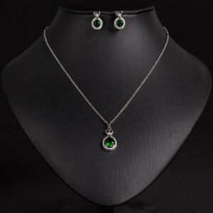 Niche crown zircon halo pendant necklace earring set wholesale featuring a micro-pave crown bail suspending a halo-set round crystal pendant with matching stud earrings from junejewelry.com