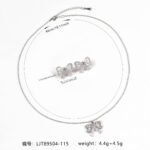 Niche bowknot crystal jewelry set wholesale featuring a sparkly baguette cubic zirconia ribbon bow pendant chain necklace and matching stud earrings from junejewelry.com