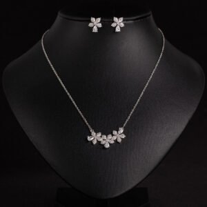 Niche triple flower crystal jewelry set wholesale featuring a curved garland of pave CZ flowers with teardrop crystal accents and matching floral stud earrings from junejewelry.com
