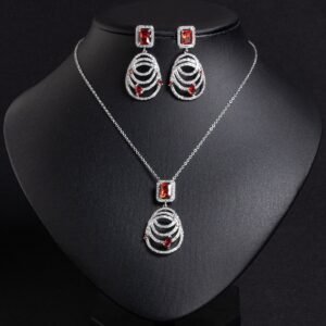Niche concentric ring drop zircon jewelry set wholesale featuring an emerald-cut halo crystal suspended above tiered concentric pave rings with matching drop earrings from junejewelry.com