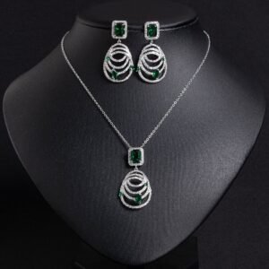 Niche concentric ring drop zircon jewelry set wholesale featuring an emerald-cut halo crystal suspended above tiered concentric pave rings with matching drop earrings from junejewelry.com