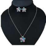 Niche five petal flower zircon jewelry set wholesale featuring a five-petal floral motif made of halo-framed pear cubic zirconia gems with matching stud earrings from junejewelry.com