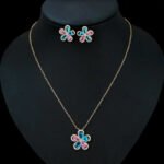 Niche five petal flower zircon jewelry set wholesale featuring a five-petal floral motif made of halo-framed pear cubic zirconia gems with matching stud earrings from junejewelry.com