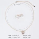 Niche bow heart crystal jewelry set wholesale featuring a delicate pave CZ bow ribbon knot topped heart crystal pendant chain necklace and matching stud earrings from junejewelry.com