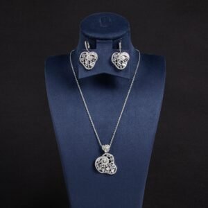 Niche swirl heart crystal jewelry set wholesale featuring an openwork filigree swirl heart pendant necklace studded with cubic zirconia and matching drop earrings from junejewelry.com