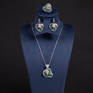 Niche swirl heart crystal jewelry set wholesale featuring an openwork filigree swirl heart pendant necklace, statement ring, and matching drop earrings studded with cubic zirconia from junejewelry.com