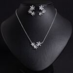Niche snowflake flower zircon jewelry set wholesale featuring clustered baguette cubic zirconia starburst snowflake blossoms with matching stud earrings from junejewelry.com