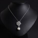 Enhance your online inventory with romantic elegance by adding our Floral pearl drop jewelry set wholesale, available at junejewelry.com. As shown in image LY5561 (4).jpg, this two-piece set artfully combines delicate botanical brilliance with classic luster. Built on an eco-friendly, tarnish-resistant platinum-plated copper base (100% lead, nickel, and cadmium free), each piece features a detailed cluster of tiny pave-set cubic zirconia blossom flowers anchored by a luminous, dangling synthetic pearl drop, paired with matching cluster drop earrings. Presented in brilliant Crystal Clear, this whimsical floral set elevates everyday commuting ensembles, wedding celebrations, formal banquets, and travel wardrobes alike. B2B buyers enjoy exceptional high quality craftsmanship at a cheap factory price designed to maximize retail margins. Order directly on junejewelry.com to benefit from export-grade packaging and free shipping on qualifying bulk wholesale purchases!