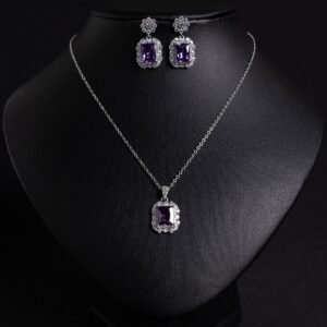 Niche emerald cut crystal jewelry set wholesale featuring a radiant halo CZ rectangular crystal pendant chain necklace and matching drop earrings from junejewelry.com