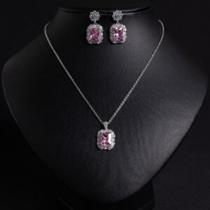 Niche emerald cut crystal jewelry set wholesale featuring a radiant halo CZ rectangular crystal pendant chain necklace and matching drop earrings from junejewelry.com
