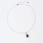 Niche emerald cut crystal jewelry set wholesale featuring a radiant halo CZ rectangular crystal pendant chain necklace and matching drop earrings from junejewelry.com