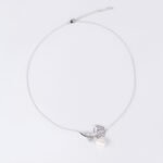 Light luxury rose pearl necklace wholesale featuring a pave CZ rose flower branch with a dangling white pearl pendant chain necklace from junejewelry.com
