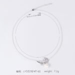 Light luxury rose pearl necklace wholesale featuring a pave CZ rose flower branch with a dangling white pearl pendant chain necklace from junejewelry.com