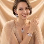 Niche feather crystal cluster jewelry set wholesale featuring marquise CZ leaf cluster pendants topped with pear-cut colored gemstones with matching earrings and ring from junejewelry.com