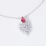 Niche feather crystal cluster jewelry set wholesale featuring marquise CZ leaf cluster pendants topped with pear-cut colored gemstones with matching earrings and ring from junejewelry.com