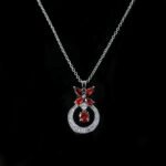 Niche butterfly crystal necklace wholesale featuring a marquise cubic zirconia butterfly top with a micro-pave crescent hoop and suspended solitaire CZ stone from junejewelry.com