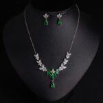 Niche vine crystal drop jewelry set wholesale featuring a marquise cubic zirconia leaf garland necklace with a dangling teardrop gem pendant and matching teardrop earrings from junejewelry.com
