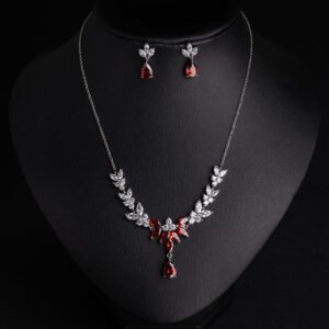 Niche vine crystal drop jewelry set wholesale featuring a marquise cubic zirconia leaf garland necklace with a dangling teardrop gem pendant and matching teardrop earrings from junejewelry.com