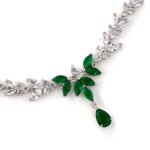 Niche vine crystal drop jewelry set wholesale featuring a marquise cubic zirconia leaf garland necklace with a dangling teardrop gem pendant and matching teardrop earrings from junejewelry.com