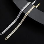Baguette CZ tennis jewelry set wholesale including necklace, drop earrings, and tennis bracelet featuring emerald-cut cubic zirconia on 18K gold and palladium plated copper.