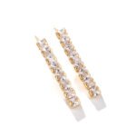 Square CZ V-necklace set wholesale including V-shaped tennis necklace and matching linear dangle drop earrings featuring princess-cut cubic zirconia on 18K gold and palladium plated copper base.