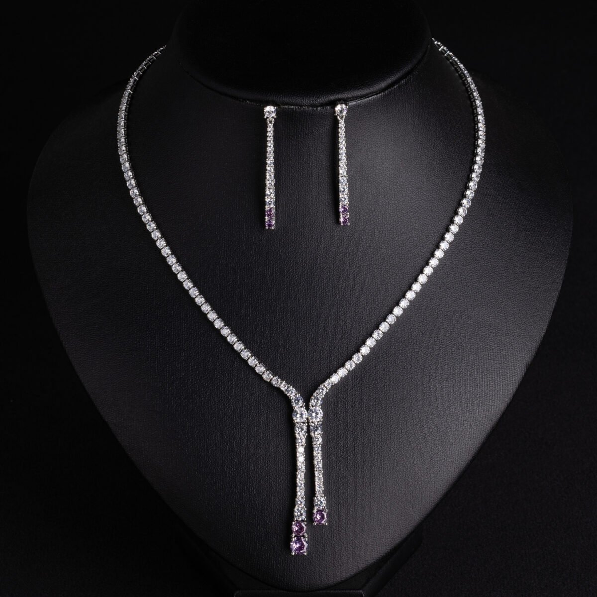 Niche lariat tennis necklace jewelry set wholesale featuring a Y-shaped drop tennis necklace and linear dangle drop earrings with sparkling cubic zirconia accents from junejewelry.com