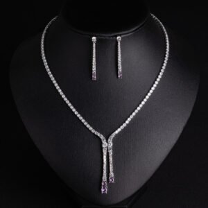 Niche lariat tennis necklace jewelry set wholesale featuring a Y-shaped drop tennis necklace and linear dangle drop earrings with sparkling cubic zirconia accents from junejewelry.com