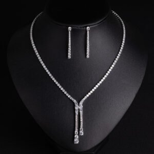 Niche lariat tennis necklace jewelry set wholesale featuring a Y-shaped drop tennis necklace and linear dangle drop earrings with sparkling cubic zirconia accents from junejewelry.com