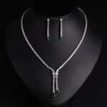 Niche lariat tennis necklace jewelry set wholesale featuring a Y-shaped drop tennis necklace and linear dangle drop earrings with sparkling cubic zirconia accents from junejewelry.com