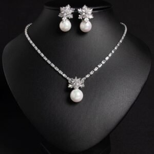 Niche snowflake pearl pendant jewelry set wholesale featuring a cubic zirconia tennis necklace with a snowflake crystal star burst and smooth pearl pendant, paired with matching pearl drop earrings from junejewelry.com