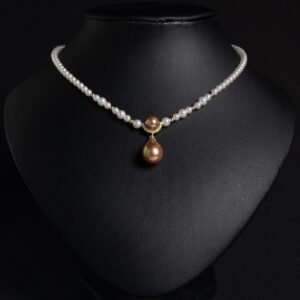 Light luxury tear drop pearl strand necklace wholesale featuring a delicate white pearl bead chain with a pave CZ arched crown connector and large teardrop pearl pendant from junejewelry.com