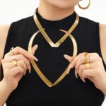 Model wearing 18K gold plated multi-strand layered V-shaped collar choker necklace