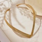 Model wearing 18K gold plated multi-strand layered V-shaped collar choker necklace