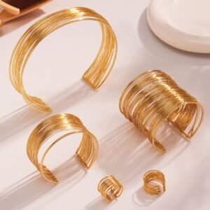 Gold and silver multi strand wire choker necklace, cuff bangle, and statement ring set model preview