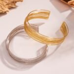 Gold and silver multi strand wire choker necklace, cuff bangle, and statement ring set model preview
