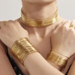 Gold and silver multi strand wire choker necklace, cuff bangle, and statement ring set model preview