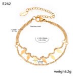 Stainless steel gold double layer chain necklace and matching bracelet set featuring geometric rhombus dangling charms.