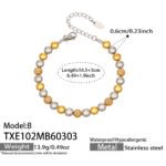 Two-tone gold and silver stainless steel jewelry set featuring alternating smooth silver beads, gold star motifs, textured gold station beads, and a sleek snake chain.