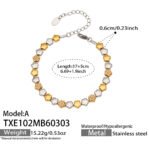 Two-tone gold and silver stainless steel jewelry set featuring alternating smooth silver beads, gold star motifs, textured gold station beads, and a sleek snake chain.