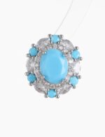 Niche vintage blue gemstone pearl jewelry set wholesale featuring an oval turquoise-blue cabochon surrounded by a halo of micro-pave zircons and turquoise accents on a pearl strand necklace with matching stud earrings from junejewelry.com