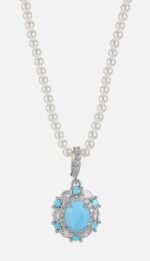 Niche vintage blue gemstone pearl jewelry set wholesale featuring an oval turquoise-blue cabochon surrounded by a halo of micro-pave zircons and turquoise accents on a pearl strand necklace with matching stud earrings from junejewelry.com
