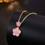 Niche multicolor flower enamel jewelry set wholesale featuring a double-tiered five-petal flower pendant with micro-beaded edges and brilliant round cubic zirconia centers, with matching drop stud earrings from junejewelry.com