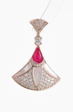 Niche fan shape pendant necklace earring set wholesale featuring a fan-shaped motif inlaid with mother-of-pearl, pave zircons, and a vibrant red teardrop gemstone from junejewelry.com