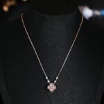 Niche four leaf clover pendant necklace wholesale featuring a four-petal clover motif framed with micro-pave cubic zirconia and round crystal stations along the chain from junejewelry.com