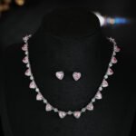 Heart zircon jewelry set wholesale 4-piece featuring heart-cut gemstone halo links on a necklace, matching tennis bracelet, solitaire halo ring, and stud earrings from junejewelry.com