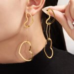 18K gold plated hollow openwork heart link chain necklace bracelet and drop earrings set model preview